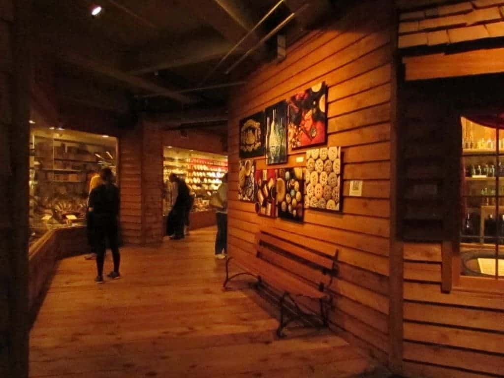 Wooden floors and walls line the display areas in the Arabia Steamboat Museum. A wooden bench offers guests a place to sit and view the collection.