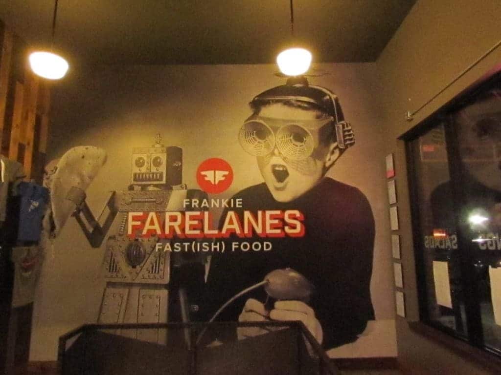 Funky graphics containing a childs robotic toy, as well as a kid in 1960's space gear adorn the wall of Frankie Farelanes restaurant.
