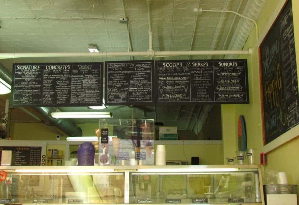 Three large chalkboards are used for the menu, and hang above the glass cases containing the ice cream.