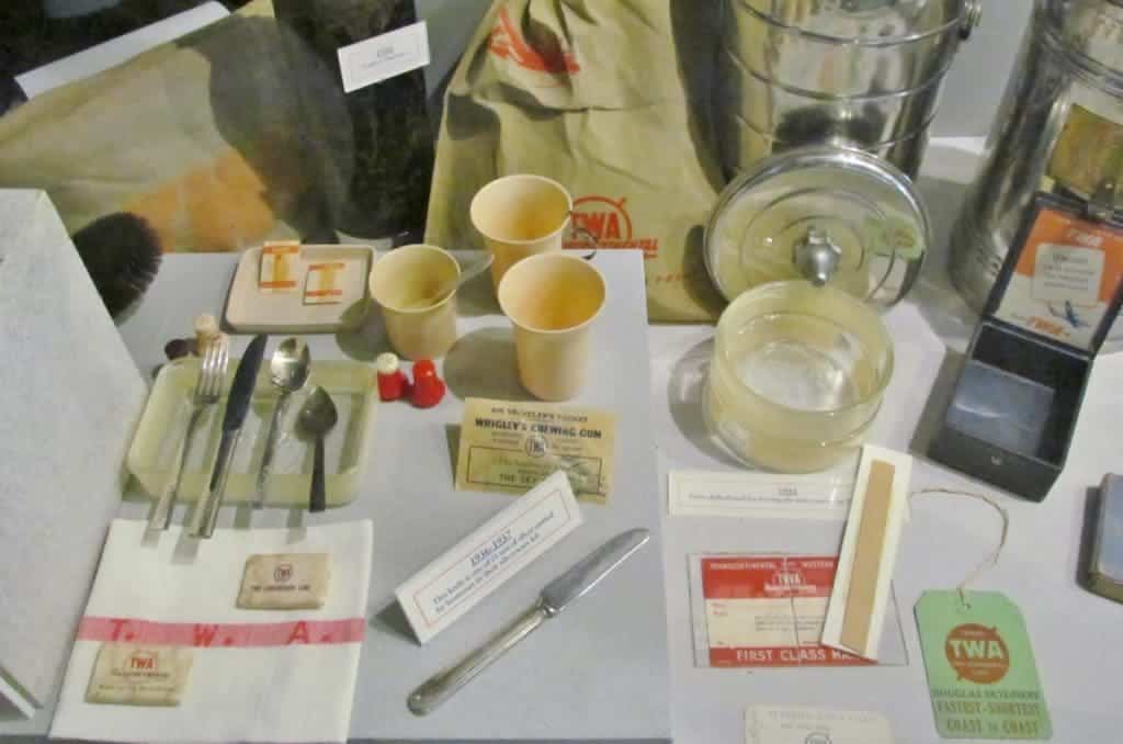 A display shows the normal serving items that would have been used on flights during the 1930's.