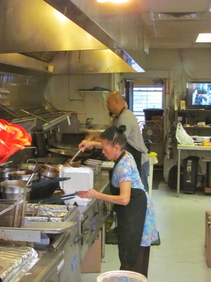 Owners Annie and Alvin prepare menu items in the galley style kitchen.