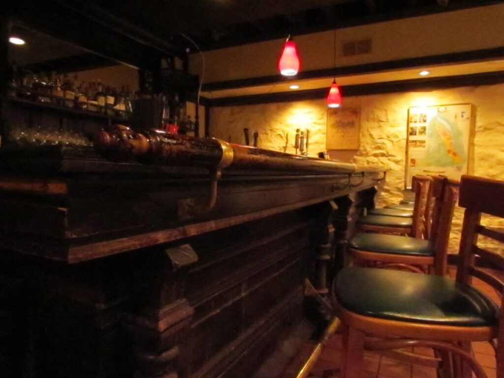 An old wooden bar is part of the scenery at The Majestic Restaurant.