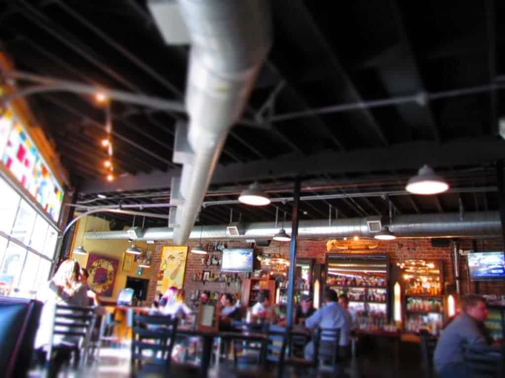 The open and eclectic industrial feel interior at Monarch in Wichita, Kansas.