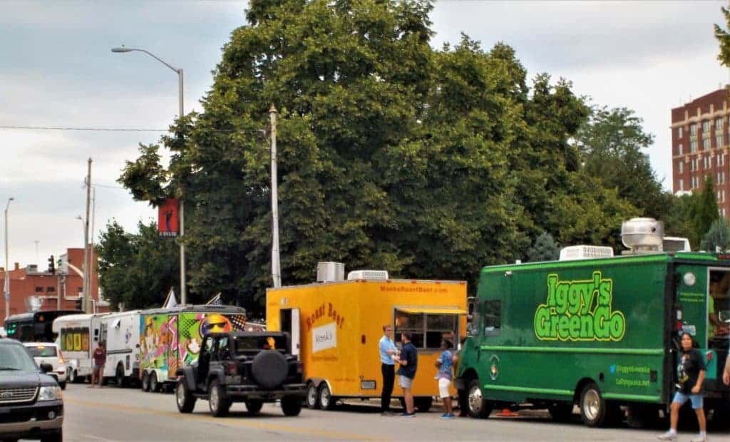 Food trucks line the streets to sell to visitors.