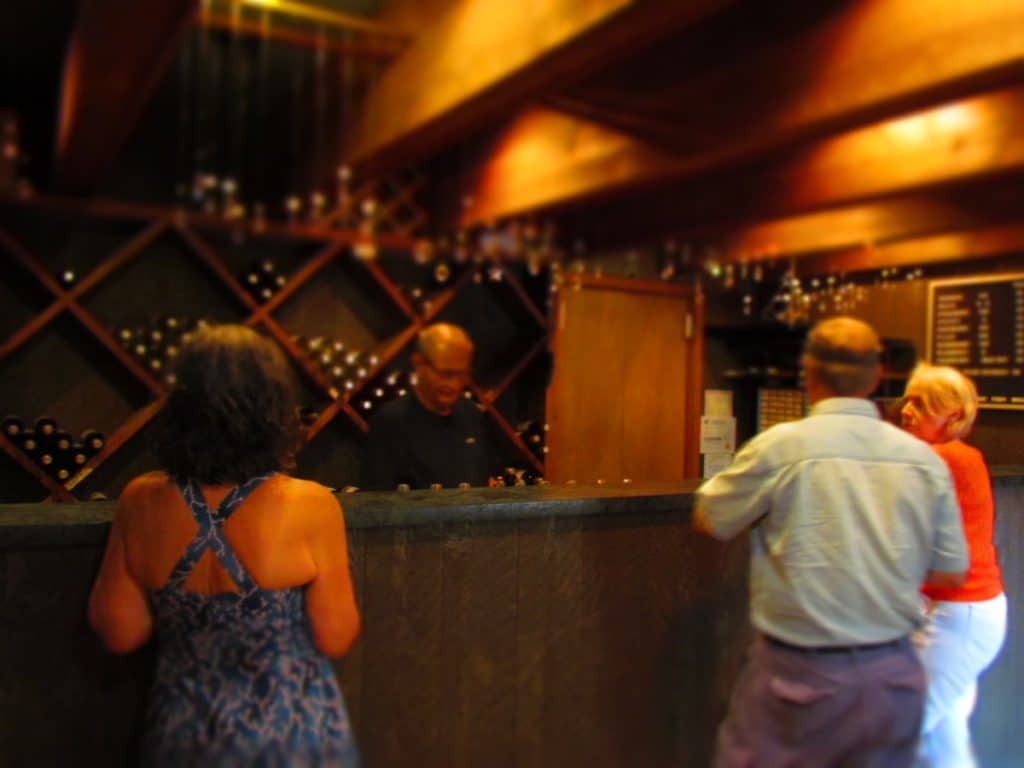 The owner serves visitors samples of their wine selection in a very unassuming fashion.