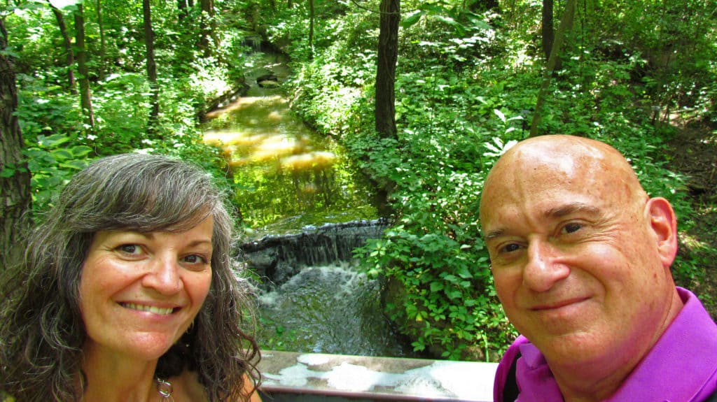 The authors pose for a selfie on front of one of the waterfalls found on the grounds of Powell Gardens.