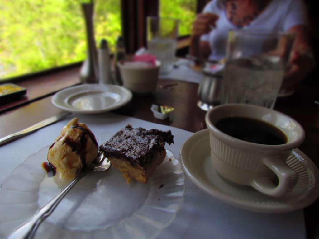 A sweet treat of cake and ice cream goes well with fresh coffee.