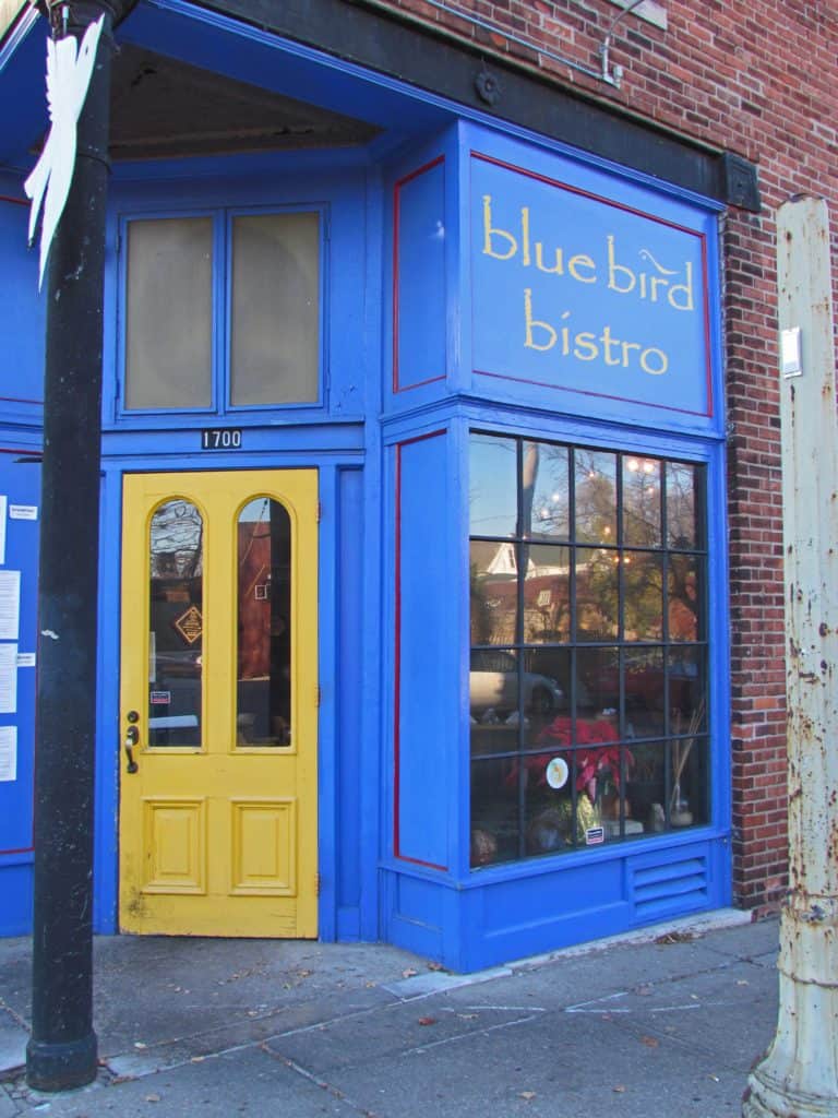 The gold door marks the entrance to the Blue Bird Bistro in Kansas City.