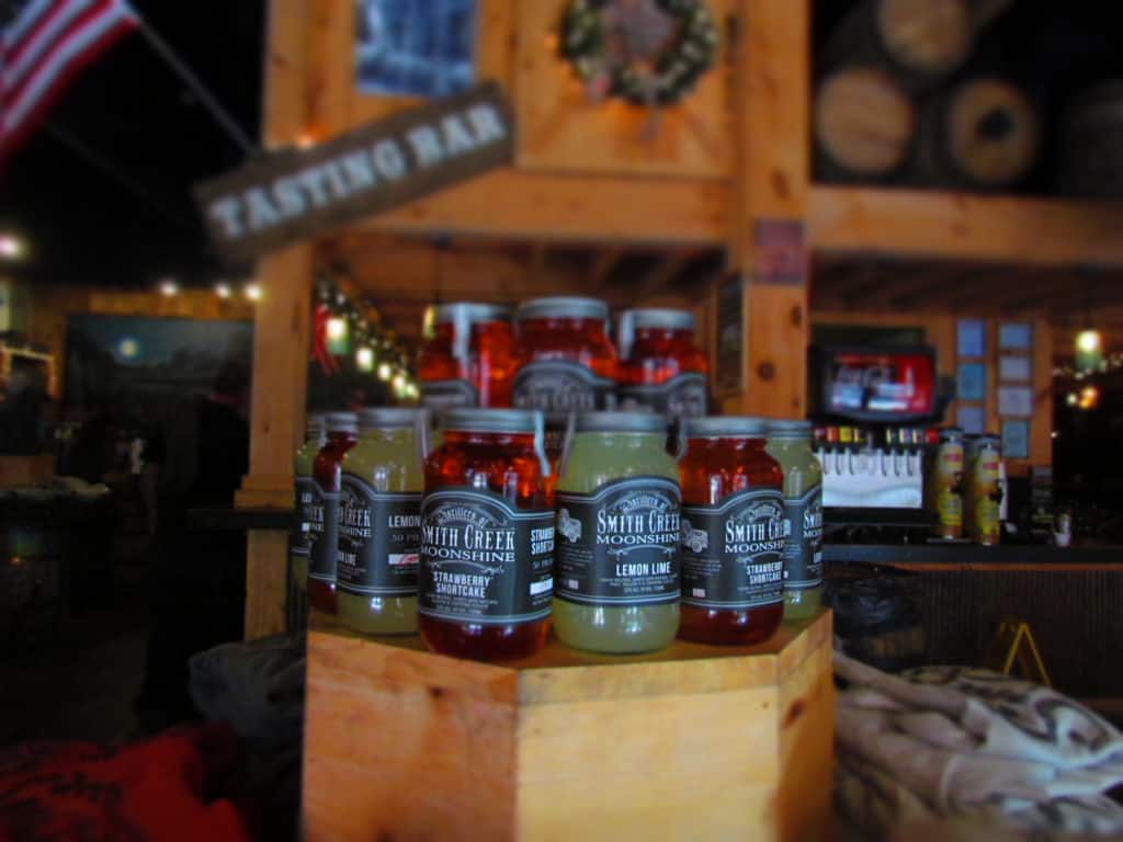 A display of moonshine shows potential flavor mixes.