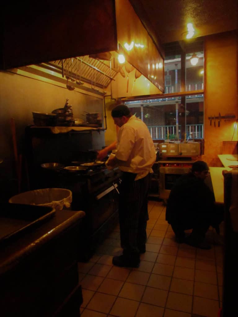 Chef Jeff Clements works his culinary magic in the kitchen of the Grand Taverne Restaurant.