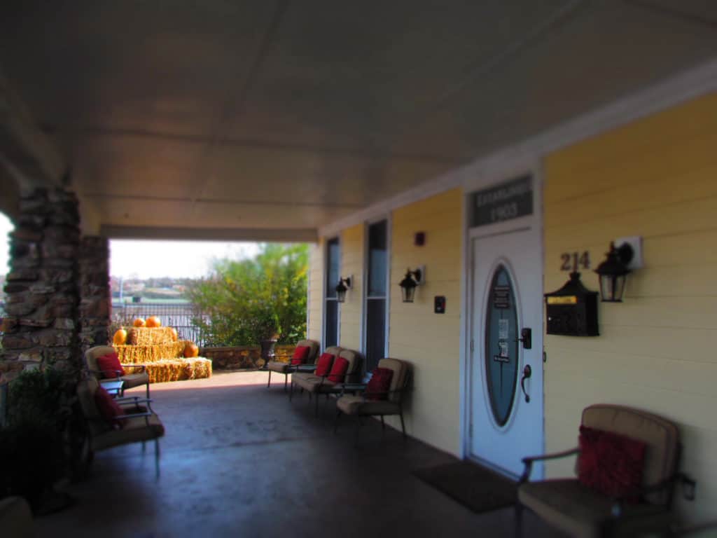 The front porch of The Branson Hotel has plenty of comfortable seating for guests to use.