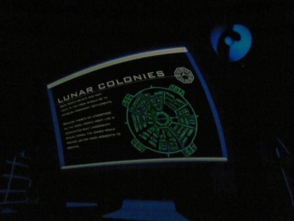 Lunar colonies are discussed during a planetarium show.