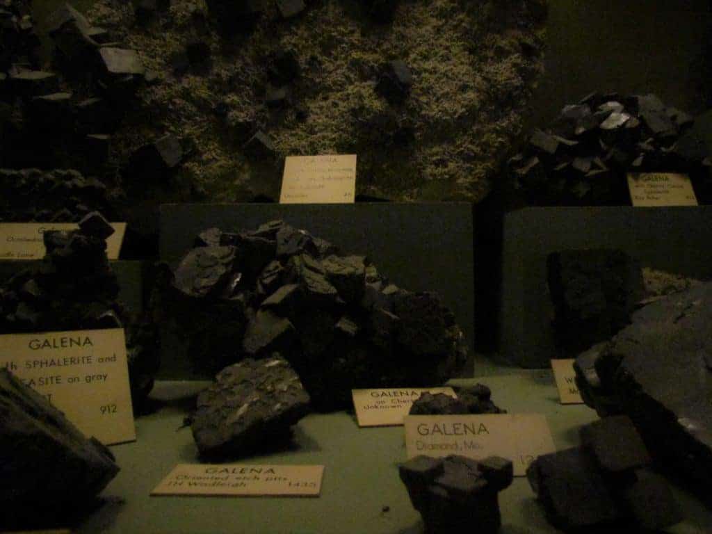 A display of Galena samples show the variety of ways this mineral is found.