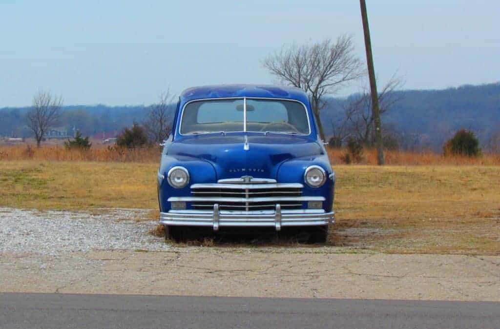 A classic car sits idly by the side of the road in Galena, Kansas.