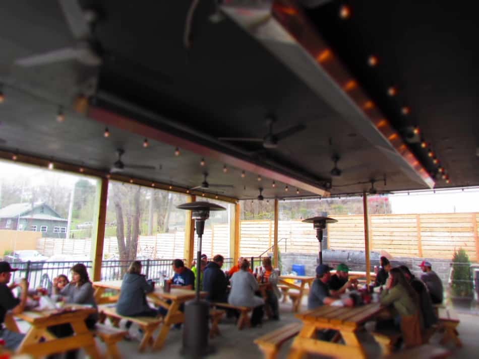 Customers brave the cool temperatures to dine outside on the covered patio.