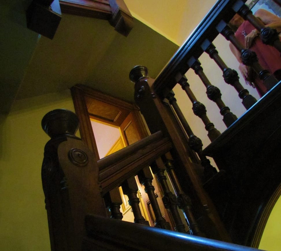 An intricately decorated staircase leads to the second floor bedrooms.