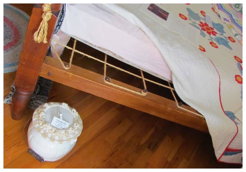 A period bed shows the need for ropes to support the mattress. 