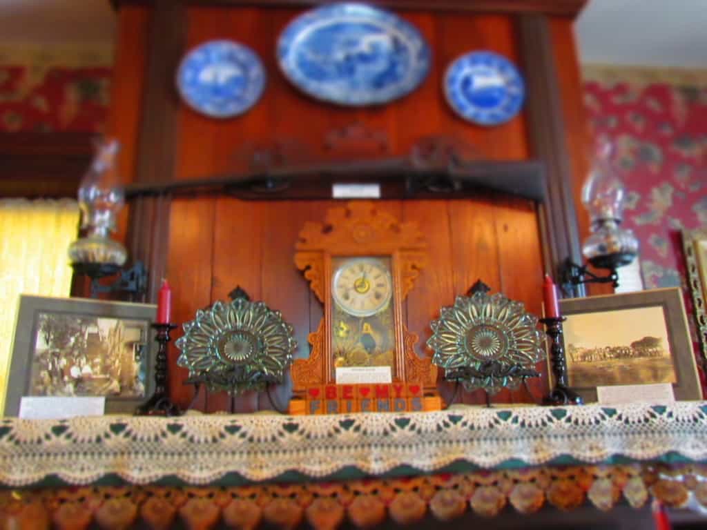 A mantle holds period pieces from the 1800's at Trail Days Cafe in Council Grove, Kansas. 