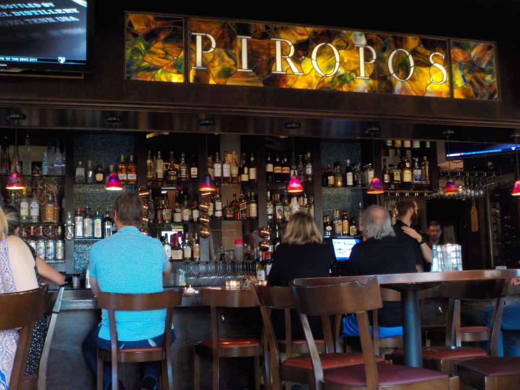 The bar area at Piropo's offers a variety of seating options.