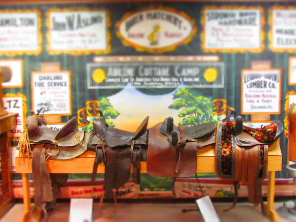 An assortment of saddles show the variety that was available for cowboys.