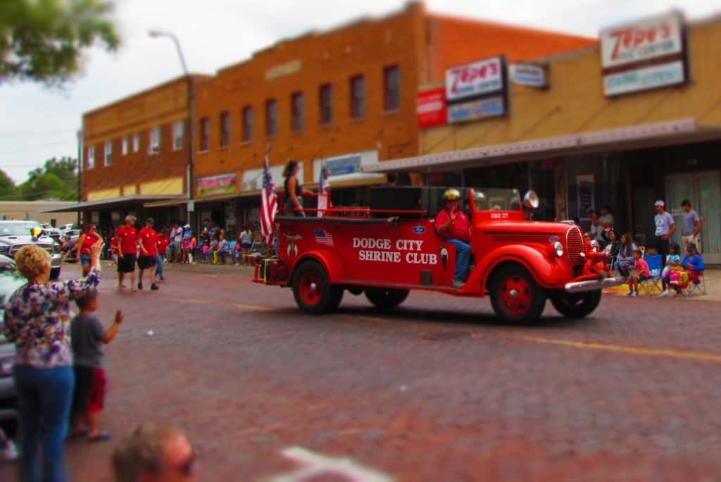 The Dodge City Shriners participate in an old fire engine.