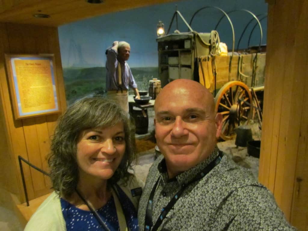 The authors pose for a selfie in front of a display at the National Cowboy & Western Heritage Museum in Oklahoma City. 