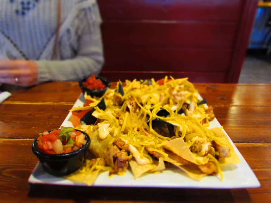 Grilled Chicken Nachos can be dressed up as much or as little as you like.