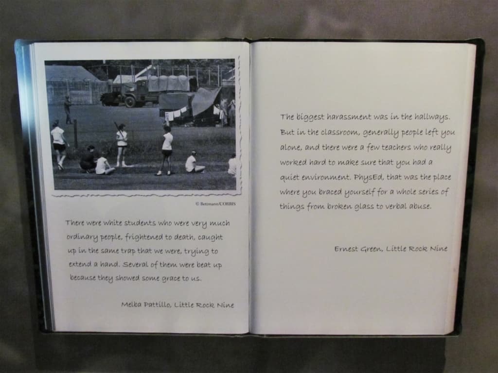 Pages from a book relate the experiences of two of the Little Rock Nine. 