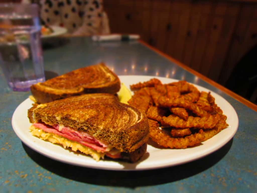 The Reuben Sandwich, at Stone Canyon Pizza, can be paired with Sweet Potato Fries for a filling lunch option.