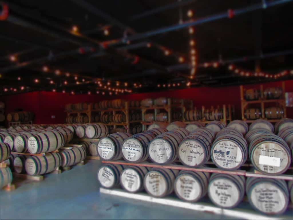 The oak barrels hold a variety of products produced at Rock Town Distillery.