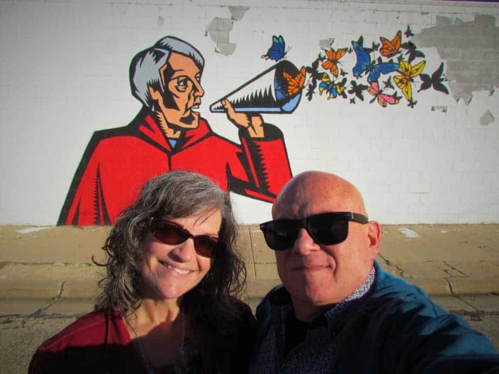 The authors pose for a selfie in front of one of the Grassroots Art Central pieces in Lucas, kansas. 