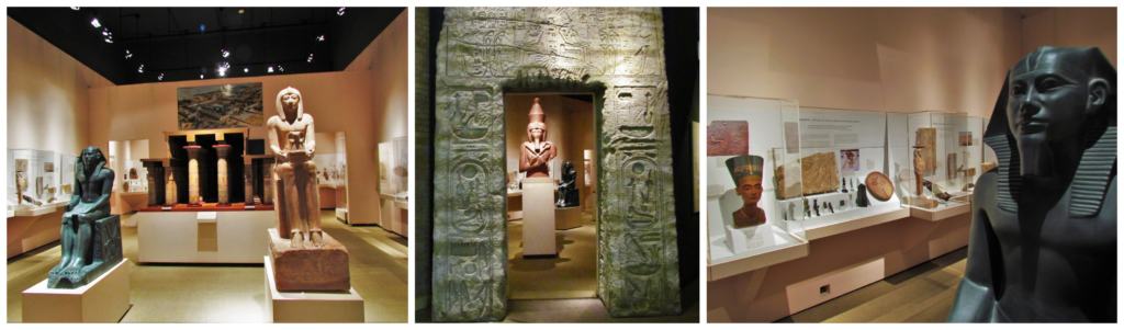 An Egyptian exhibit is packed with sculptures, carved reliefs, and various artifacts. 