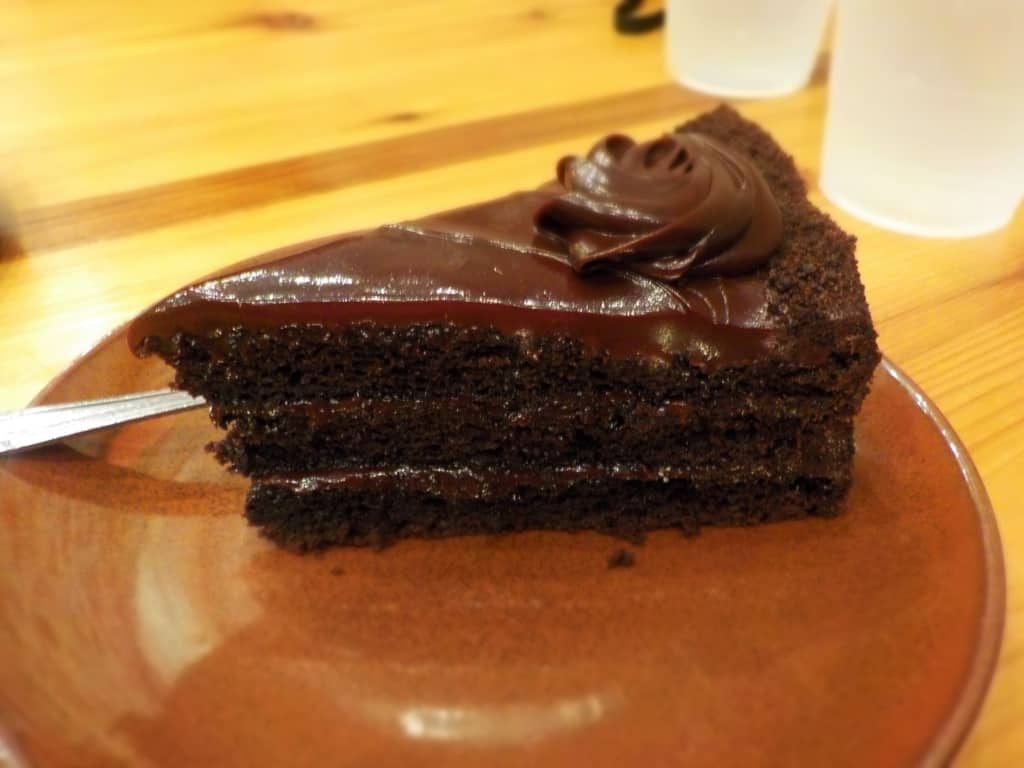 A moist slice of Chocolate Cake makes for a perfect dessert.