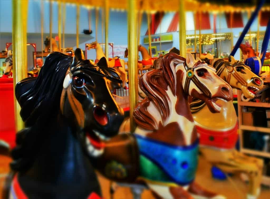 The beautiful carved horses almost seem alive during a visit to the CW Parker Carousel Museum. 