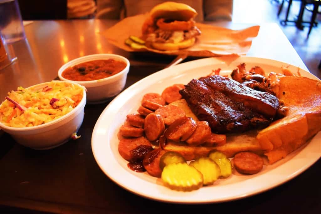 The Hogamaniac Platter sets out three meats and two sides in a feeding smorgasbord. 