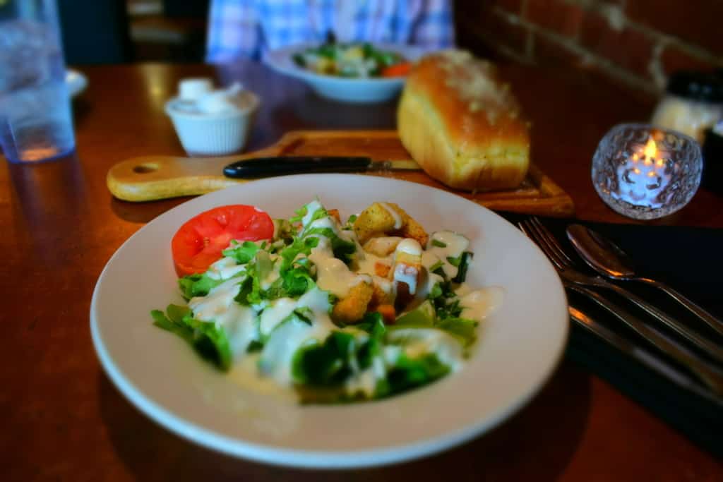 A fresh house salad is a great start when combined with fresh baked bread.