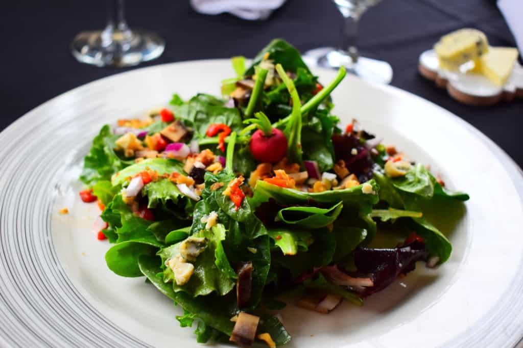 Even a house salad shows signs of refined elegance at Cafe des Amis.