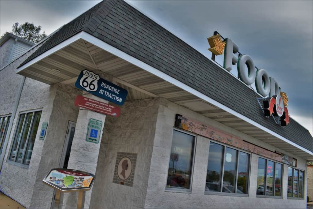A visit to Cozy Dog Drive In helps detail the origin of corn dogs in Springfield, Illinois. 