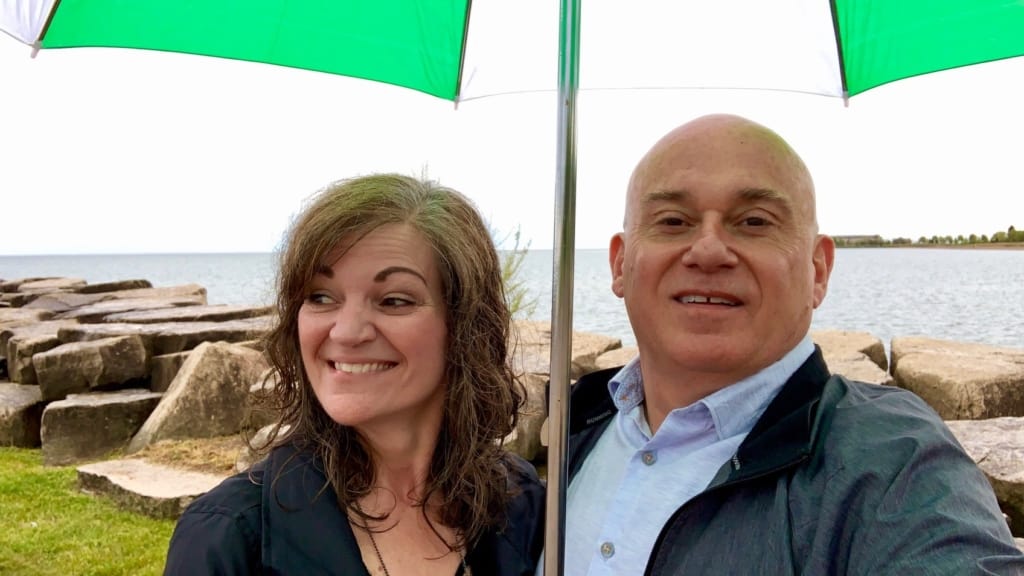 The authors stop for a selfie under gray skies. 