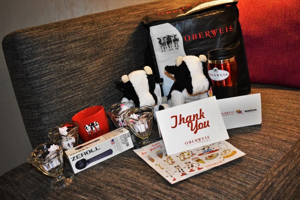 A swag bag from Oberweis Dairy is packed full of logo'd items. 