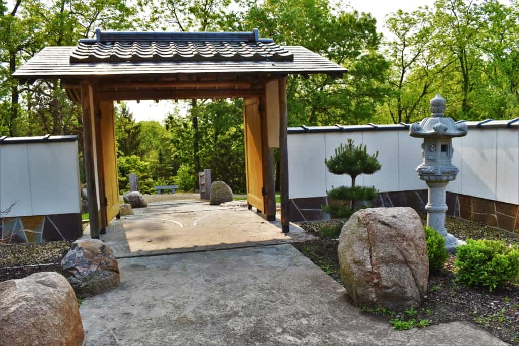 Stepping through the Japanese garden Gate leads to a tranquil garden. 