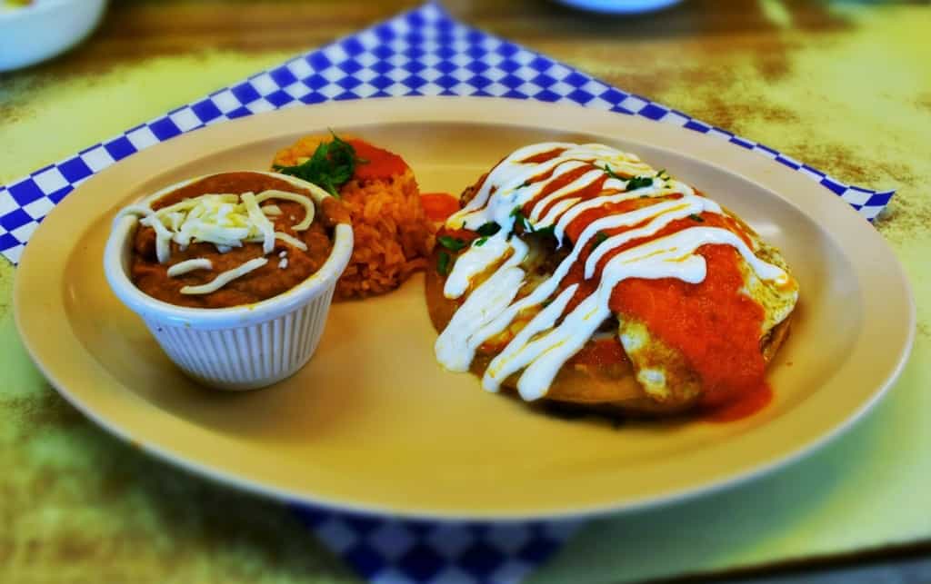 The Chicken Enchilada is a beautifully designed dish that incorporates fried eggs into the meal. 