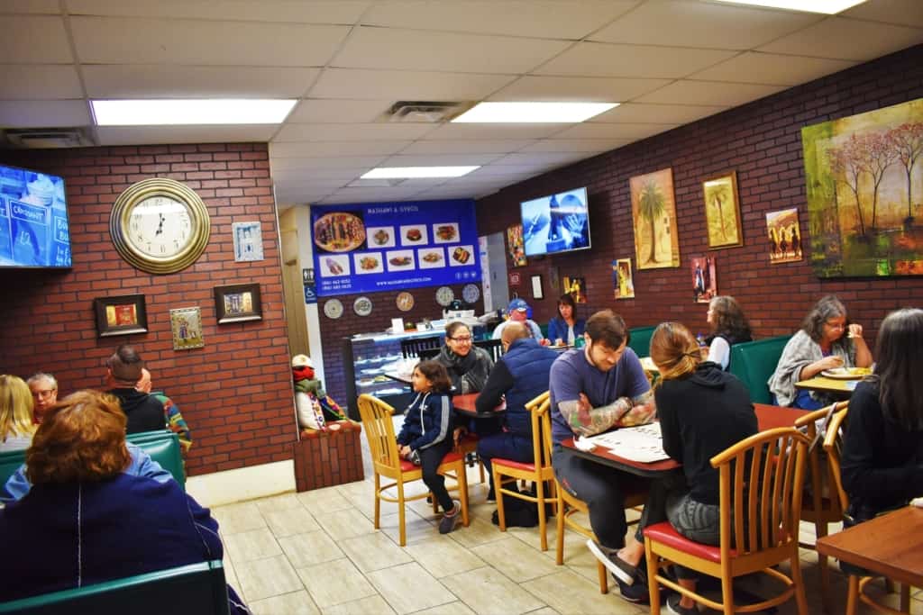 Dinnertime draws in hordes of locals to enjoy the delectable dishes at Queen Sweets Bakery in Kansas City. 