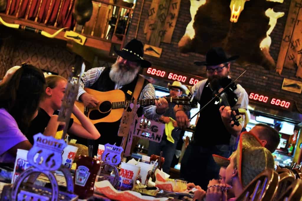 Strolling musicians channel the cowboy spirit as they entertain the diners at The Big Texan.