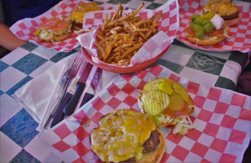 A table full of burgers and French fries makes a great scene for lunch at Coyote Bluff Cafe.