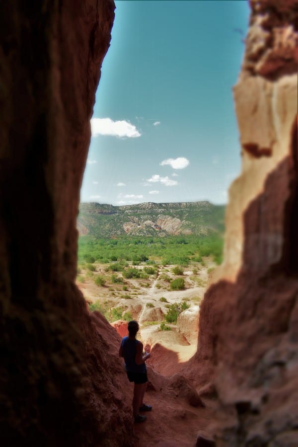 Standing in the shade of a cave gave us an opportunity to gaze at the beauty of the Canyon.