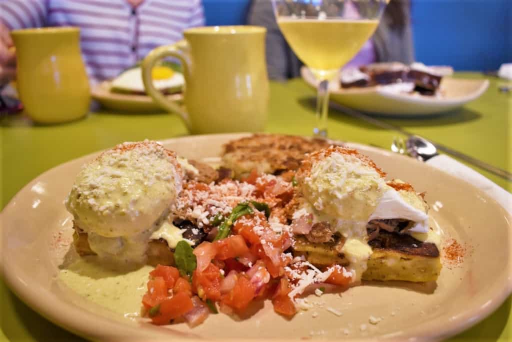 Looking for something new is easy at Snooze, since they have a menu filled with unique dishes like the Chili Verde Benedict.