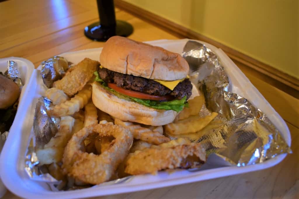 A classic cheeseburger basket is a great choice for an easy carryout meal from a hole in the wall dining destination.