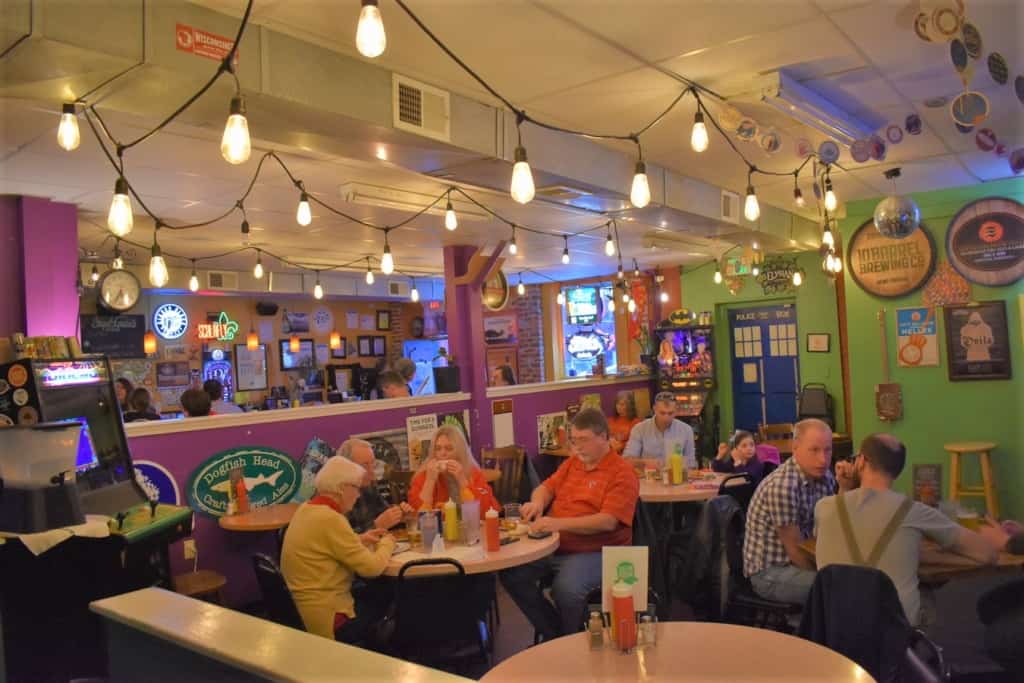 The seating space in green Room Burgers a & Beers is designed for socializing, not social distancing. 
