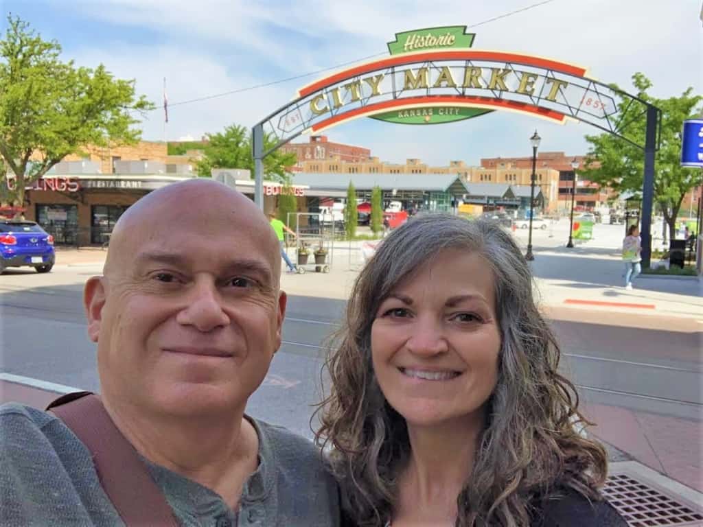 The authors drop their masks to pose for a quick selfie at City Market in Kansas City.